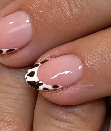 Classic French nails with a chocolate animal-print tip