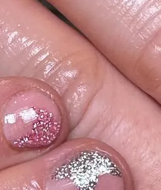 Short nails with red and silver glitter heart tips