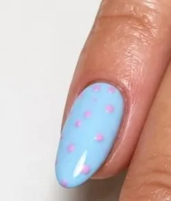 Pastel blue nail with tiny pink dots